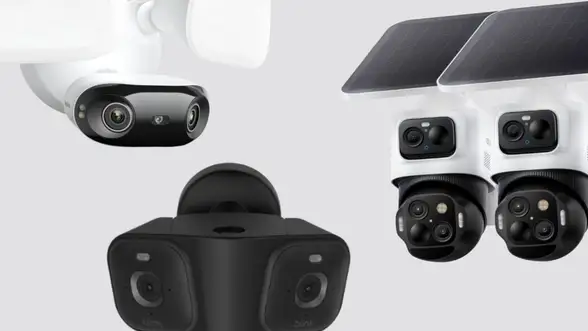 Three large sized security cameras on a gray background