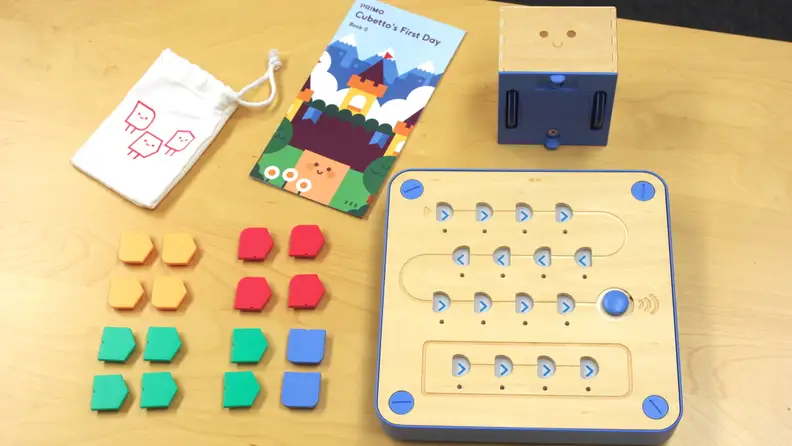 Cubetto comes with tiles, a control board, Cubetto himself, a storybook, and a playmat