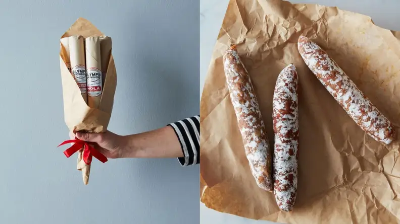 arm reaching out with bouquet of salami.