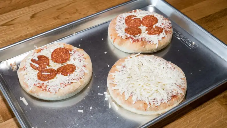 Uncooked pizza on a baking sheet