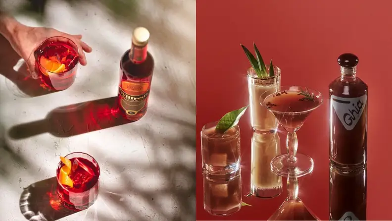 Left: A bright red bottle of Wilfred's  arranged beside colorful non-alcoholic mixed drinks with other pink, orange, and purple tones. Right: A bottle of Ghia aperitif sits on a reflective surface next to elegant non-alcoholic mixed drinks on a deep red background.