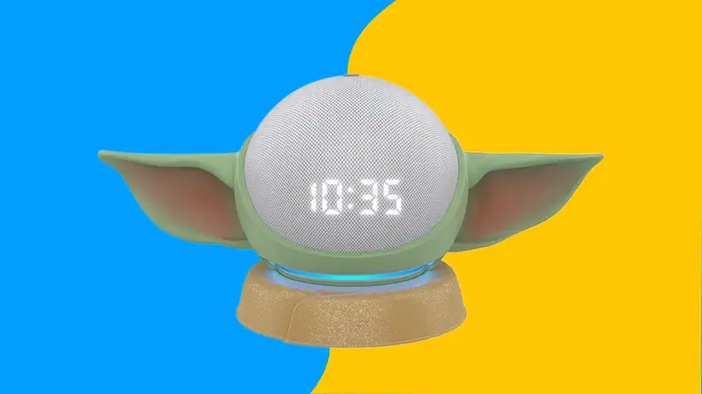 A baby Yoda shaped alarm clock with LED time display.