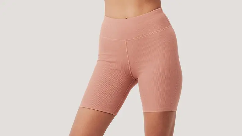 Woman wearin clay colored bike shorts
