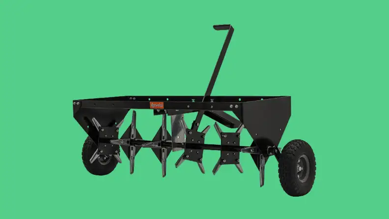 A core aerator in front of a background.