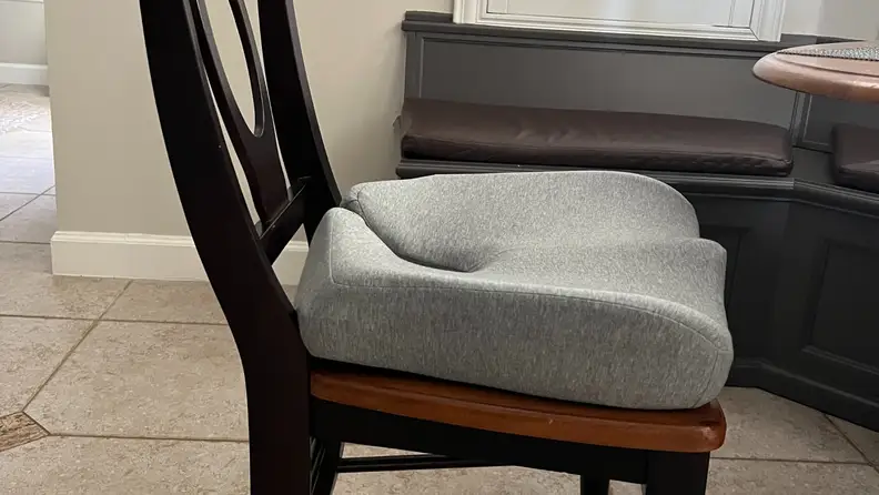 The cushion placed on a chair.
