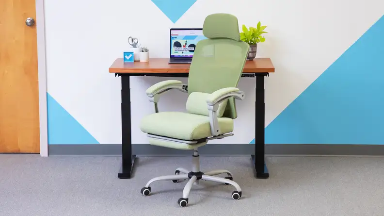 Green Edx Reclining Office Chair in front of desk with laptop computer.