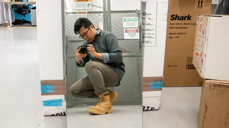 Man in trousers and boots kneeling