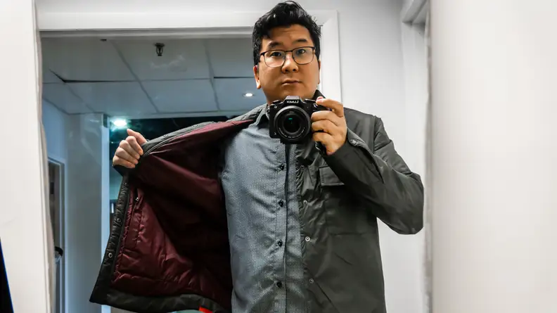 Man showing the inside of his jacket