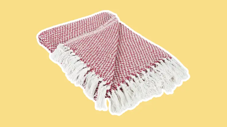 DII 100% Cotton Basket Weave Throw blanket on a yellow background.