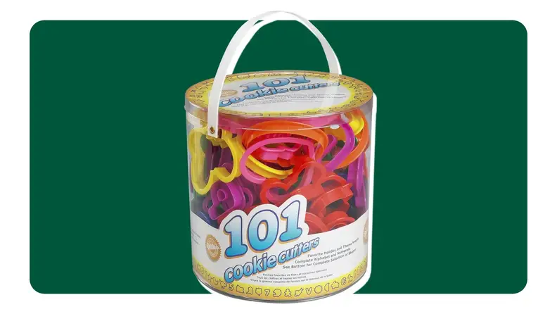 On left, bucket of cookie cutters on green background. On right, cookie cutters shaping dough on a countertop