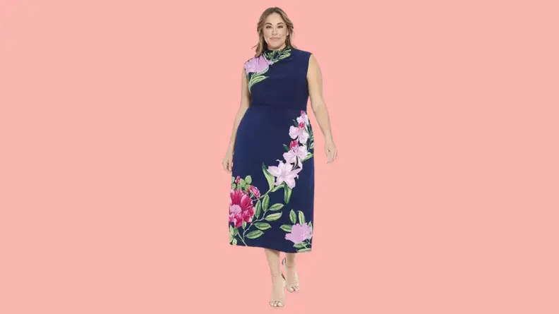 A model wearing a floral midi dress.