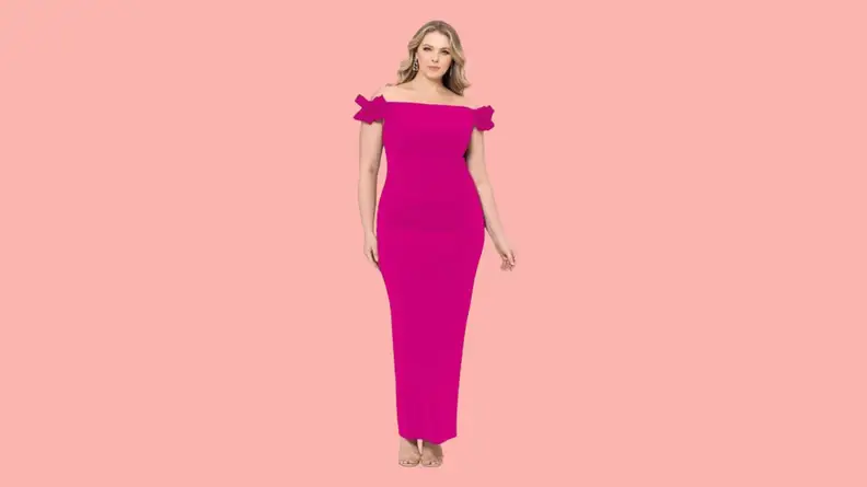 A model wearing a pink off-the-shoulder gown with bow details.