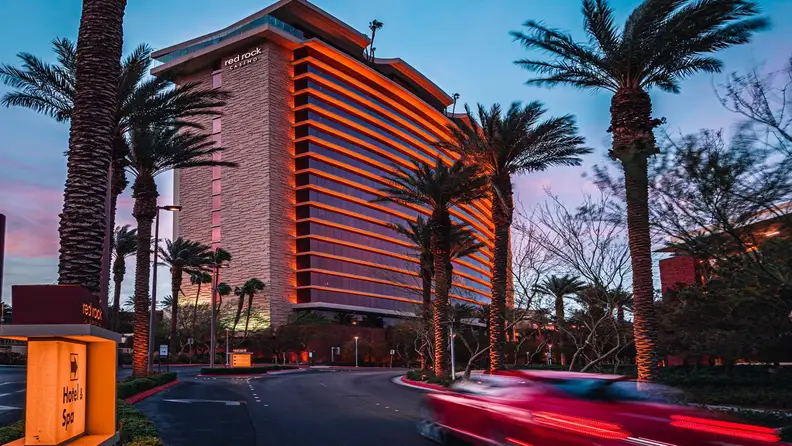 A red vehicle on its way to a Vegas casino resort
