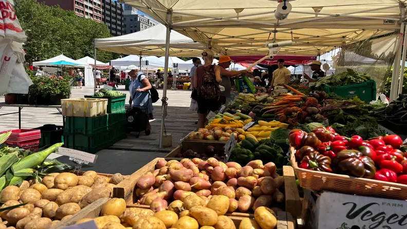 Market tents set up at Copley Square with crowd shopping
