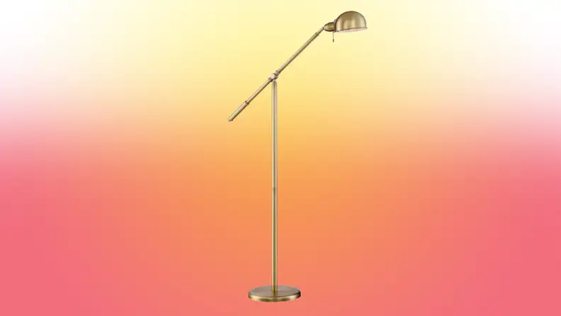 A lamp stands on a red and yellow fade background