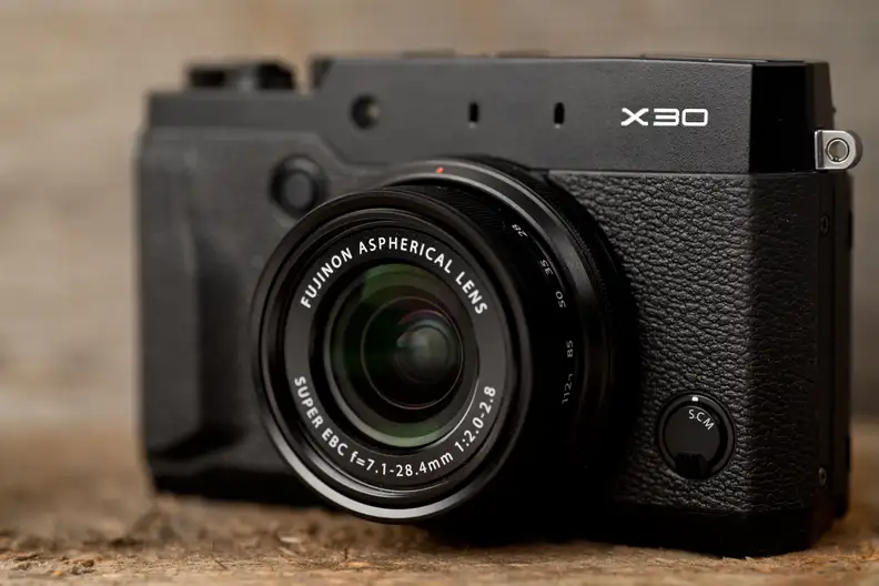 A photo of the Fujifilm X30's front face.