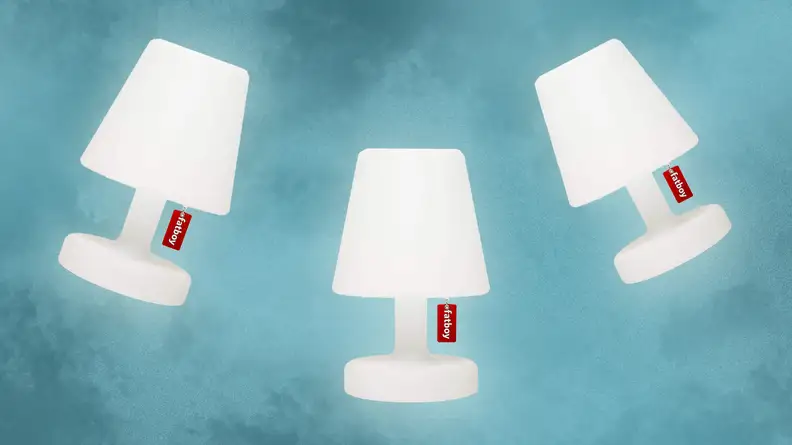Three white Fatboy Edison The Petit Lamps side by side.