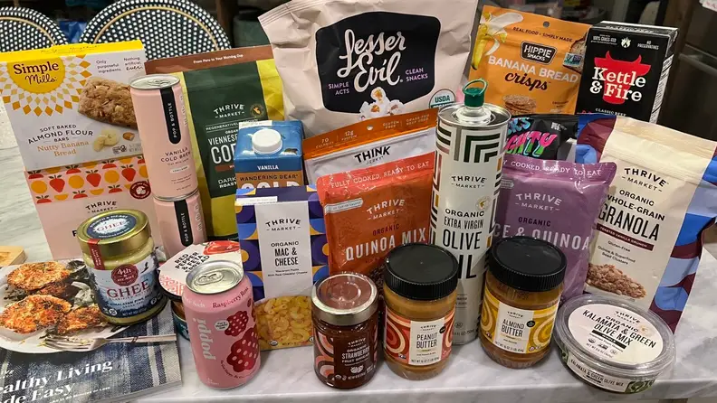 An array of Thrive Market grocery items laid out on a countertop.