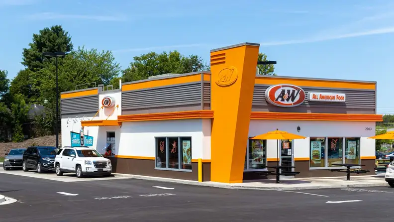 Exterior of an A&W restaurant with cars parked outside