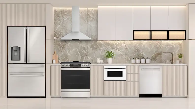 Coordinated stainless steel kitchen appliance package in a modern kitchen.