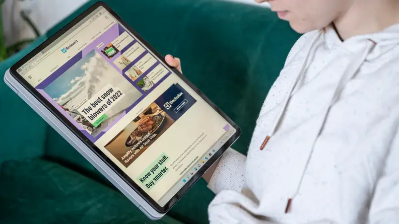 person uses laptop as tablet