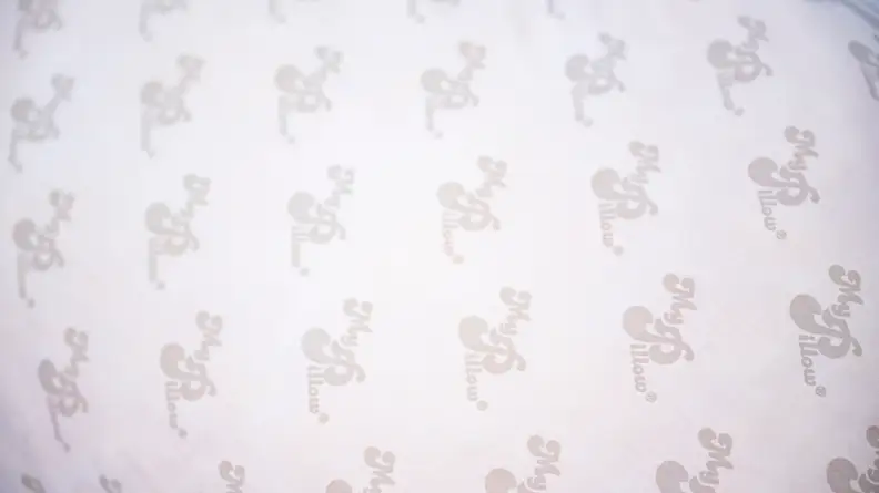 Pillow surface with the MyPillow logo printed all over.