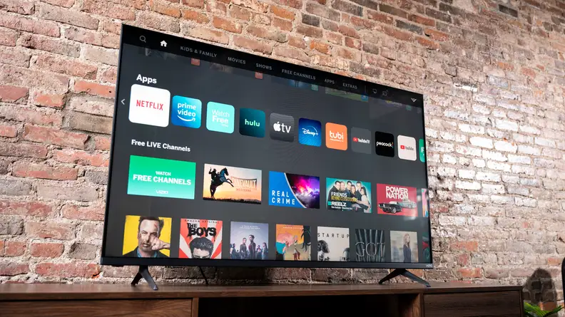 The Vizio M-Series MQ6 displaying its home screen in a living room setting