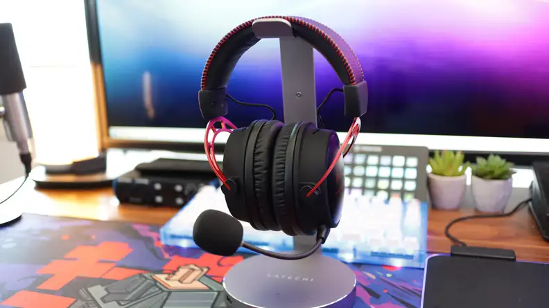 A full shot of a red and black gaming headset