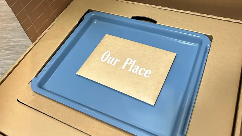 Packaging of a blue Our Place Wonder Oven Pro air fryer.
