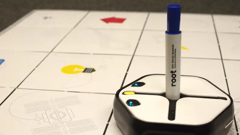 Root Robotics can draw with a marker on a foldable whiteboard grid.