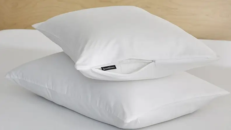two pillows stacked atop one another with brooklinen pillow protectors