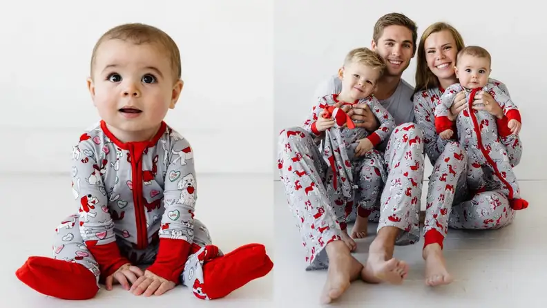 Family smiling in matching Valentine's Day pajamas.