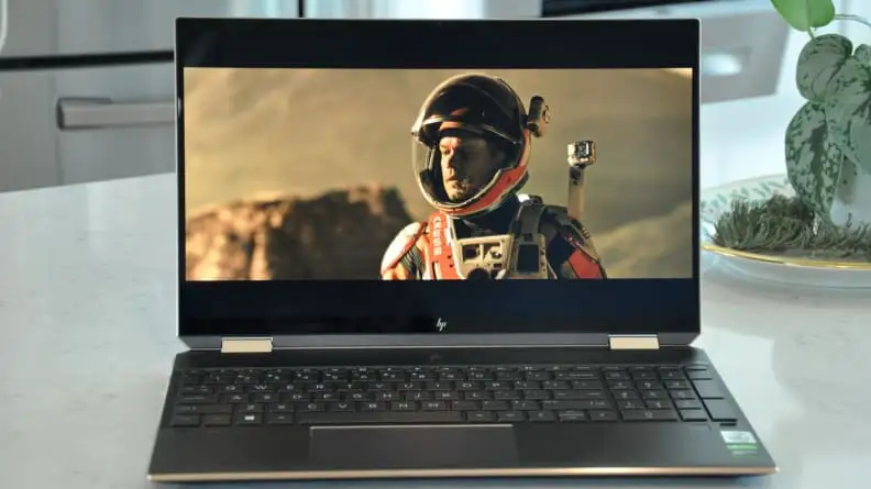 a laptop is open on a countertop