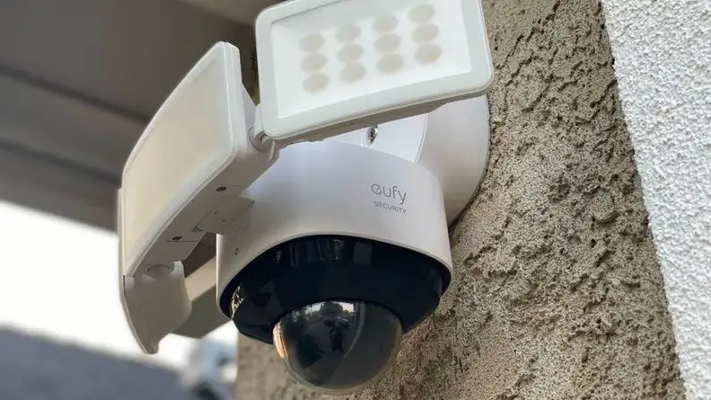 Mounted Eufy Floodlight Cam 2 Pro mounted outside of home.