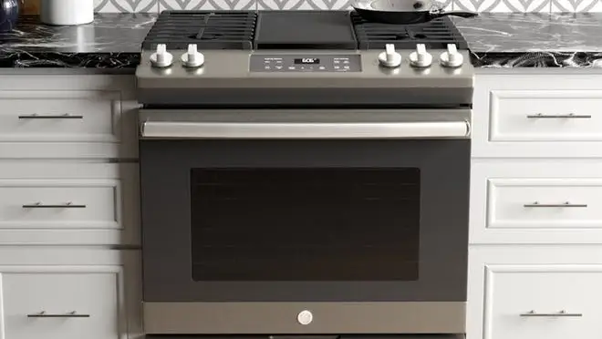 Electric gas range in kitchen.