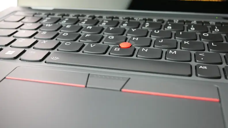 Close up view of the power and finger print button on the keyboard of the Lenovo ThinkPad L13 Yoga laptop.