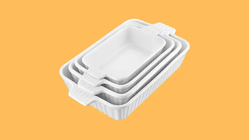 A set of four nesting casserole dishes  on yellow background