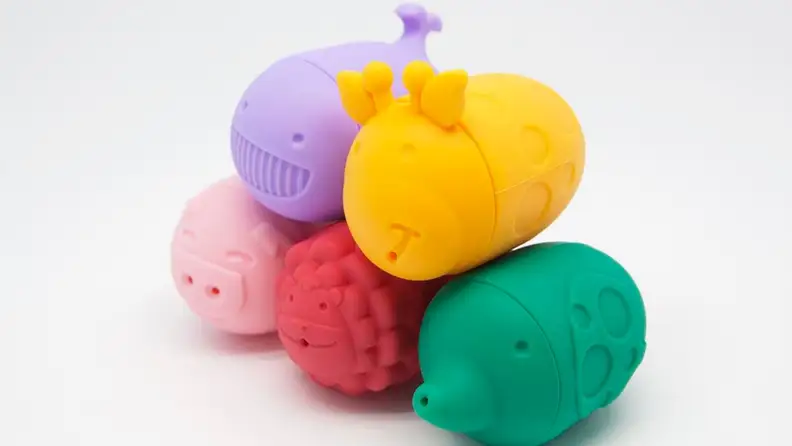 A stack of colorful bath toys made from food-grade silicone.