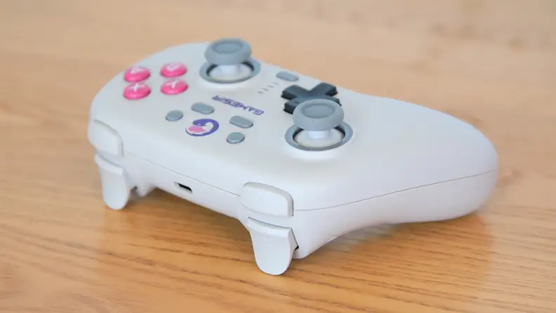 The GameSir Nova, a white controller with pink buttons on a table