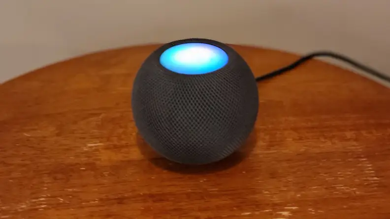 HomePod Mini with top illuminated in listen mode