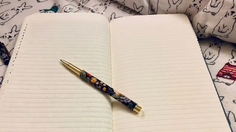 blank journal with pen