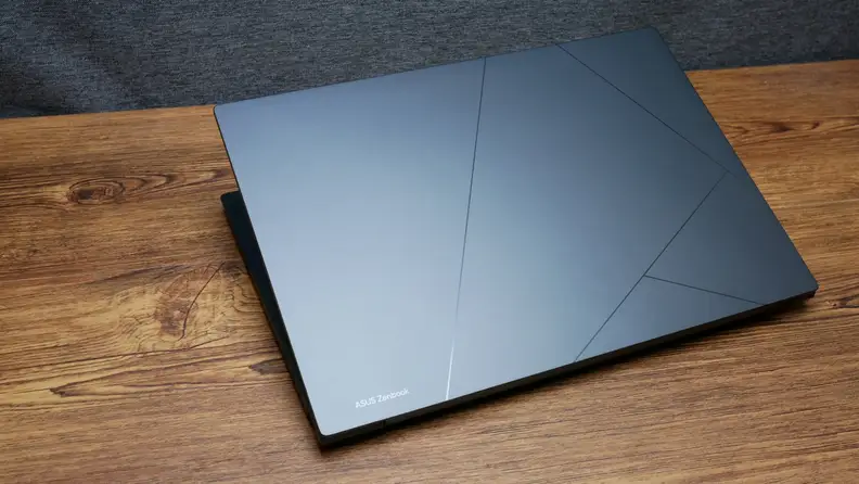 The laptop closed, showing the Asus logo and design.