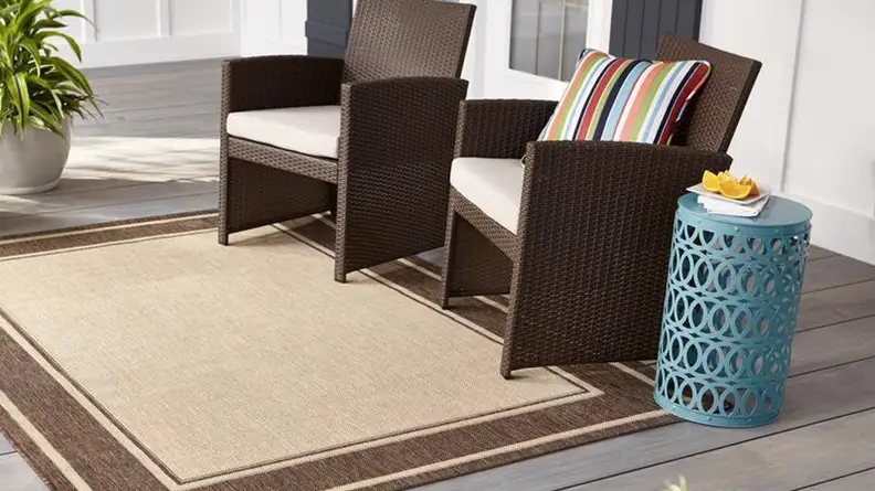 A bright teal metal side table in a living room