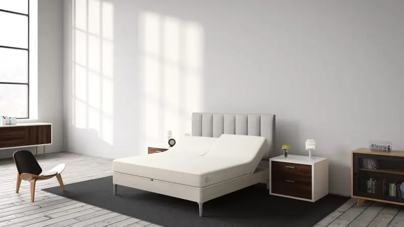 Bare Sleep Number mattress on a bed frame in a bedroom