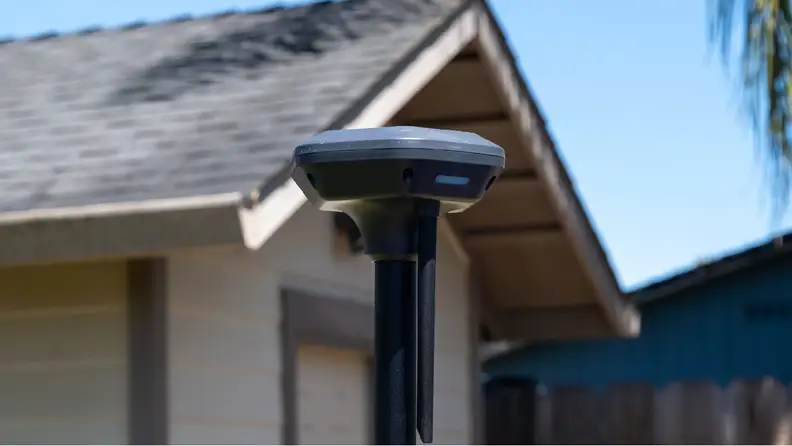 AirSeekers RTK system standing up in front of a house.