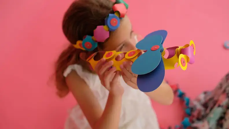 A child playing with a Clixo airplane.