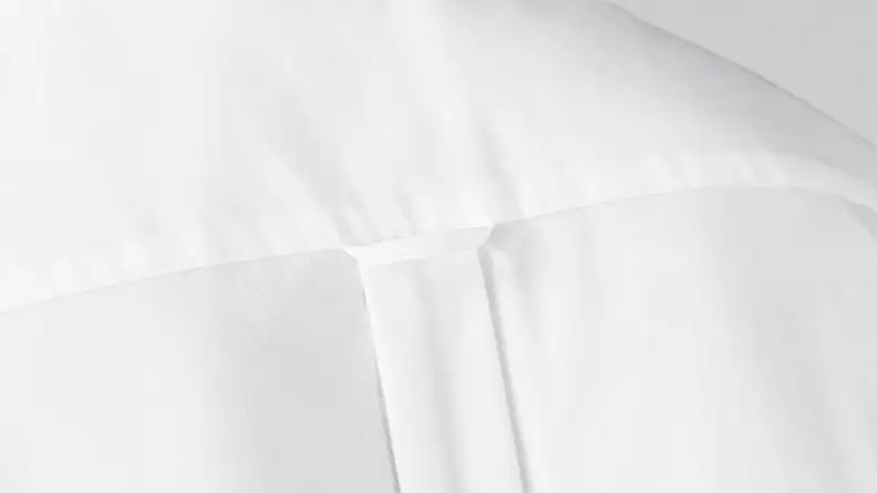 Back of white oxford button-down shirt by Gant, displaying locker loop on back of piece.