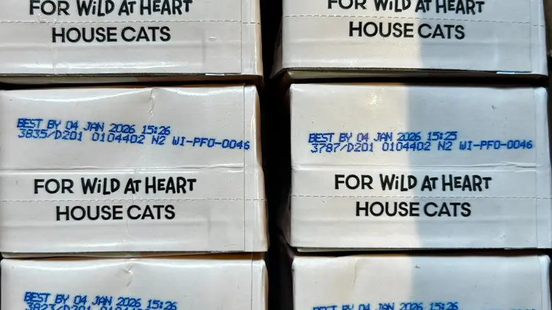 Boxes of Really Great Cat Food arranged upside down.