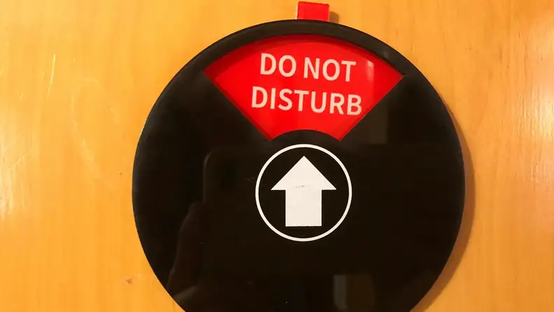 The Privacy Sign set to the red setting, "do not distrub."