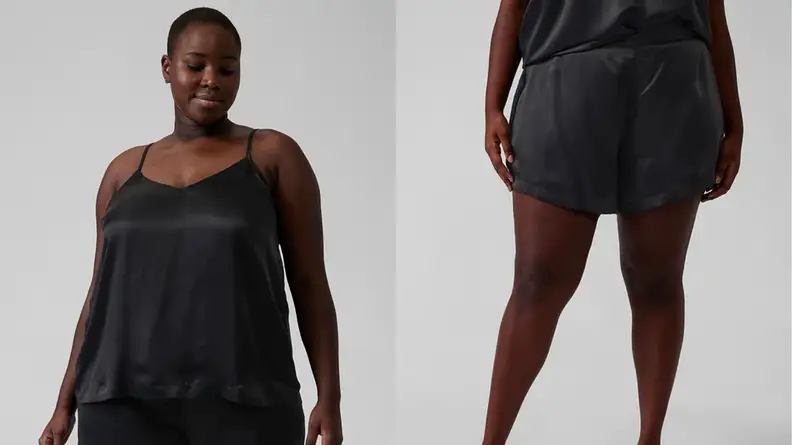 An image of a Black woman in a silky black cami top, next to an image of the same woman seen from the back in a pair of silky black shorts.